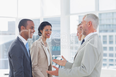 Happy business team chatting Happy business team chatting