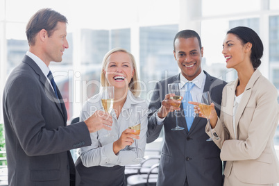 Business team celebrating with champagne