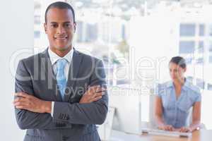 Businessman standing with arms crossed