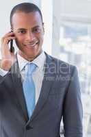 Smiling businessman on a call