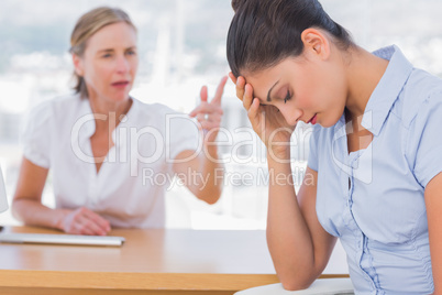 Businesswoman arguing with a colleague