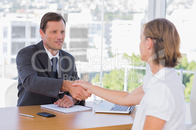 Businessman shaking hand of a job applicant