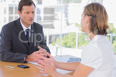 Businessman having a discussion with a job applicant