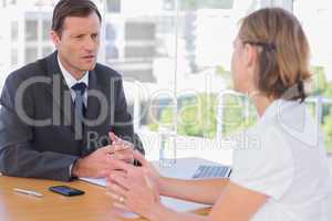 Businessman having a discussion with a job applicant