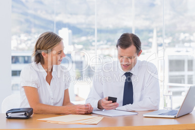 Businessman looking at his smartphone