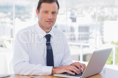 Businessman working with his laptop