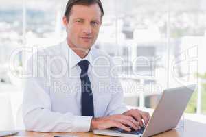 Businessman working with his laptop