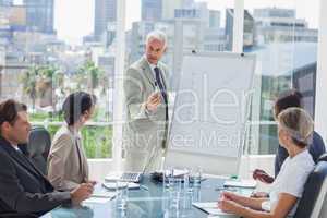 Serious businessman giving a presentation