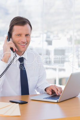 Cheerful businessman on the phone