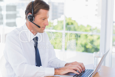 Serious businessman wearing a headset