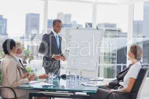 Businessman standing in front of a whiteboard