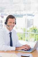 Smiling businessman wearing a headset