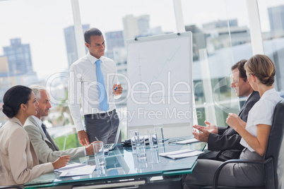 Manager standing in front of colleagues