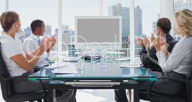 Business people applauding during a video conference