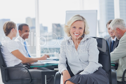 Attractive businesswoman posing in the boardroom