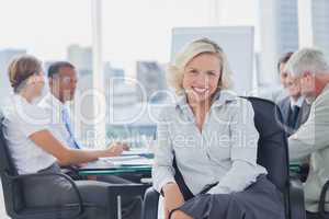 Attractive businesswoman posing in the boardroom