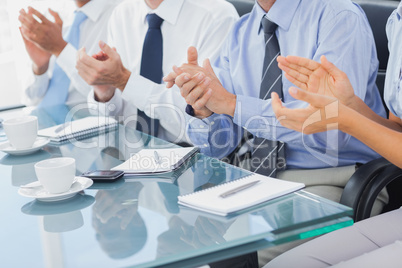 Group of business people applauding in the boardroom