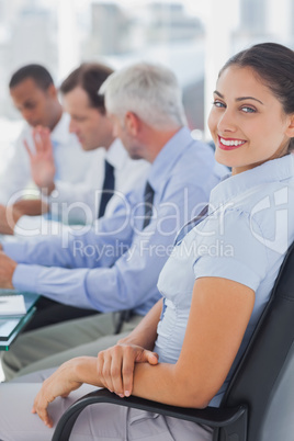 Pretty businesswoman posing in the meeting room