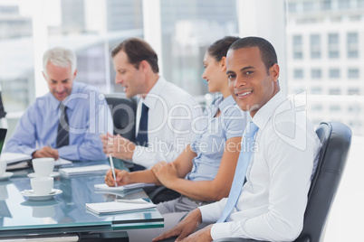 Handsome businessman posing in the meeting room