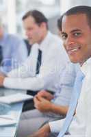 Happy businessman posing in the meeting room