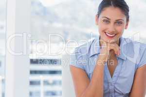 Attractive businesswoman sitting at her desk