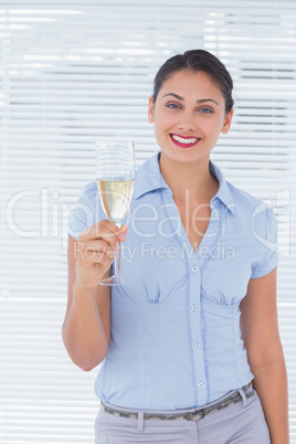 Pretty businesswoman with champagne