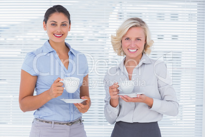 Cheerful coworkers smiling