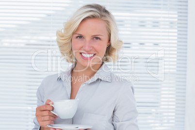 Businesswoman holding a cup