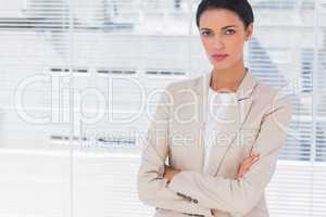 Serious businesswoman with arms folded