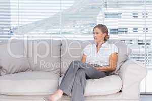 Businesswoman sitting on couch