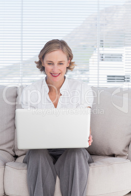 Portait of cheerful businesswoman with a laptop