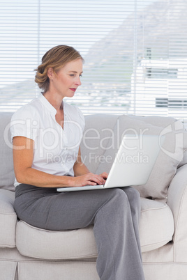 Businesswoman sitting on sofa