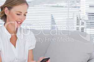 Businesswoman using her mobile phone