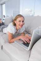 Relaxed businesswoman using her laptop