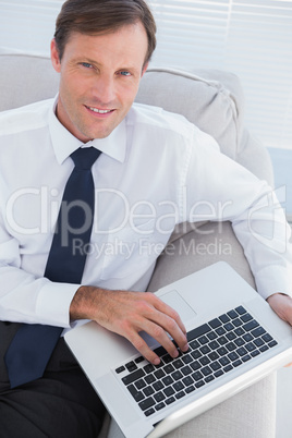 Businessman typing on his laptop