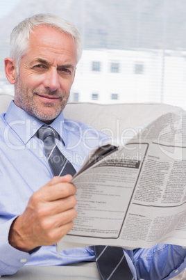 Businessman reading a newspaper