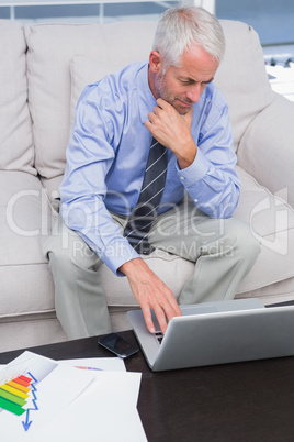 Businessman doing work with his laptop