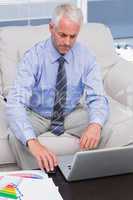 Businessman working with his laptop