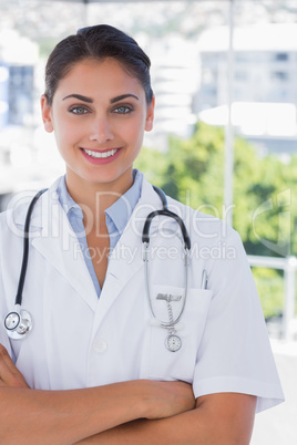 Young doctor with arms crossed