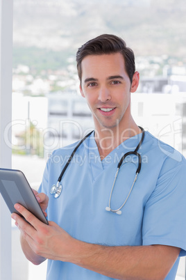 Male nurse holding a tablet pc