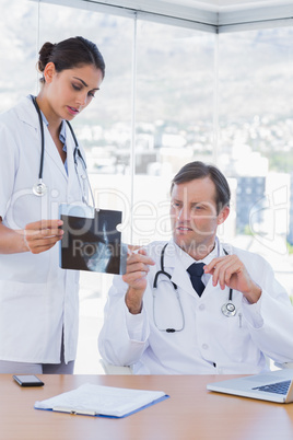 Doctor showing a x ray to a colleague