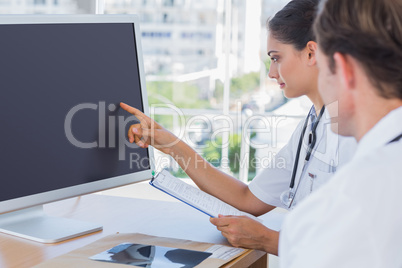 Doctor pointing at the screen of a computer