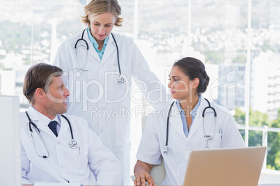 Group of doctors discussing and working together