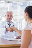 Patient shaking hands to doctor