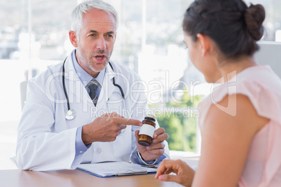 Doctor explaining the pills to patient