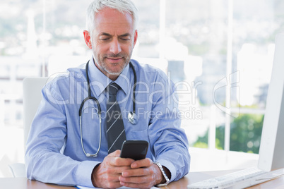 Doctor using his smartphone