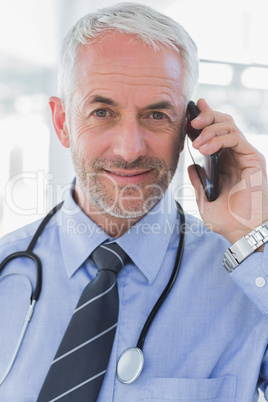 Cheerful doctor calling