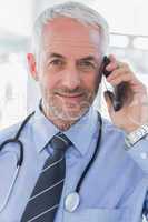 Cheerful doctor calling