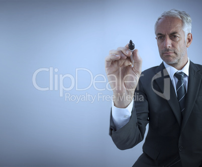Businessman holding a marker Businessman holding a marker