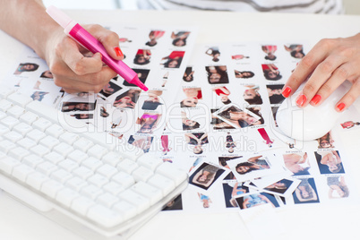 Female photo editor working on a contact sheet